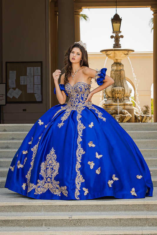 Royal Blue Gold Butterfly Accented Quince dress with Removable Pouf Arm Cuffs front view with puffs