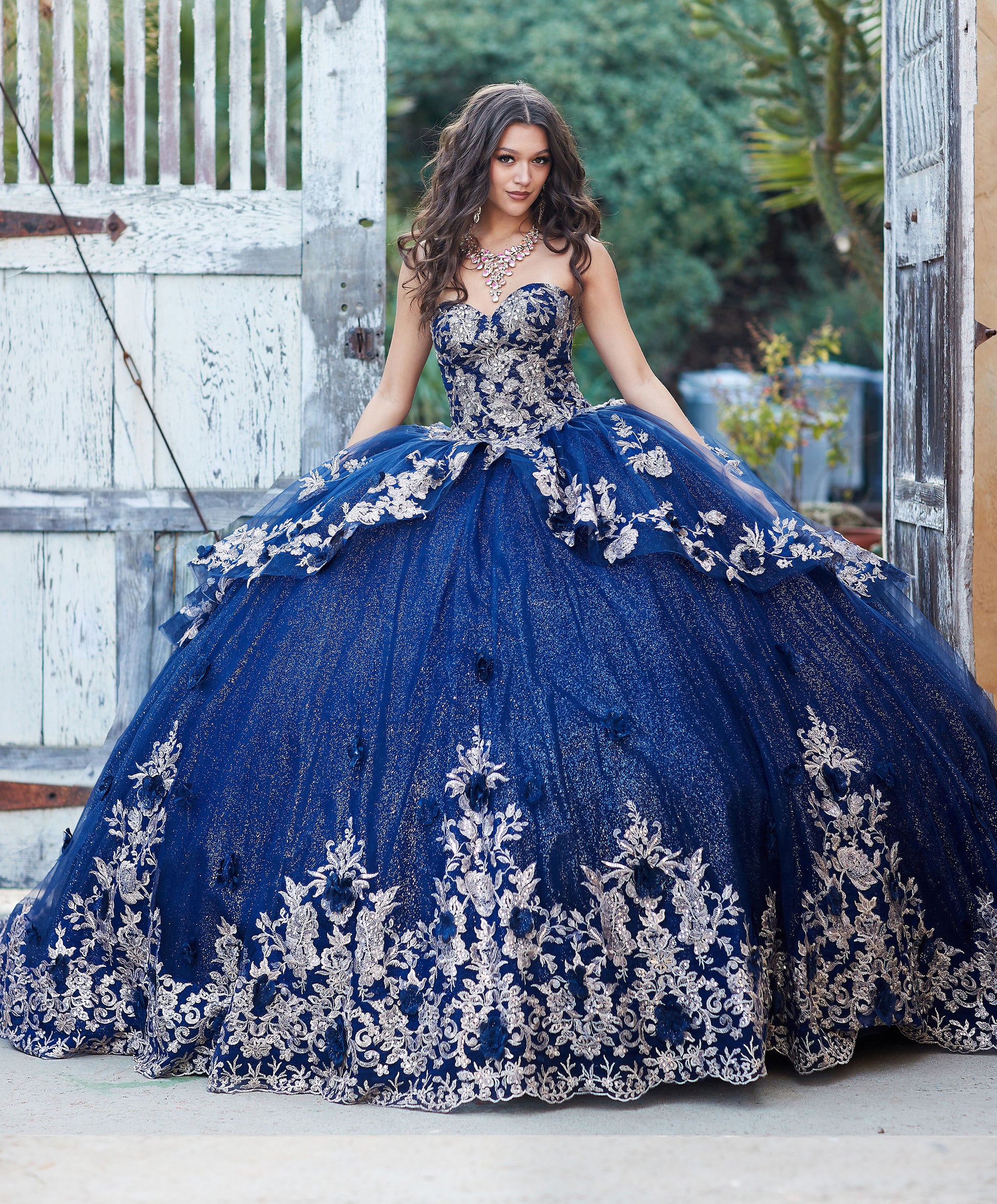 Quinceanera | Navy Glittery Overlay Ball Gown with Golden Embroidered Top Adorned with Sequins and Gems  | Aitanna dress front view