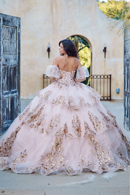 Quinceanera | Detachable Puffy Sleeve Champagne Ballgown | Gold Embroidered and Sequin Bodice Quince dress - back view of woman wearing dress