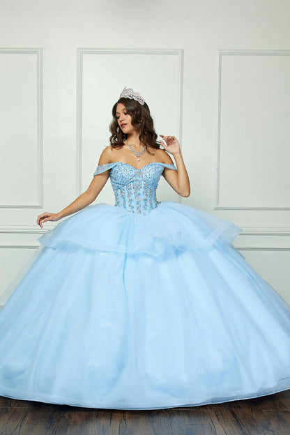 Quinceañera | Blue Glittering Tulle Layers, Off-shoulder Bodice adornments, and a detachable bow - front view of woman wearing dress with crown and one hand held up