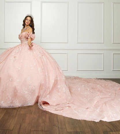 Quinceañera | Long Train, 3D Flowers, Rhinestones w/ Embroidered See-through Bodice Quince dress | Detachable Ruffle Sleeves - full side view of woman wearing dress