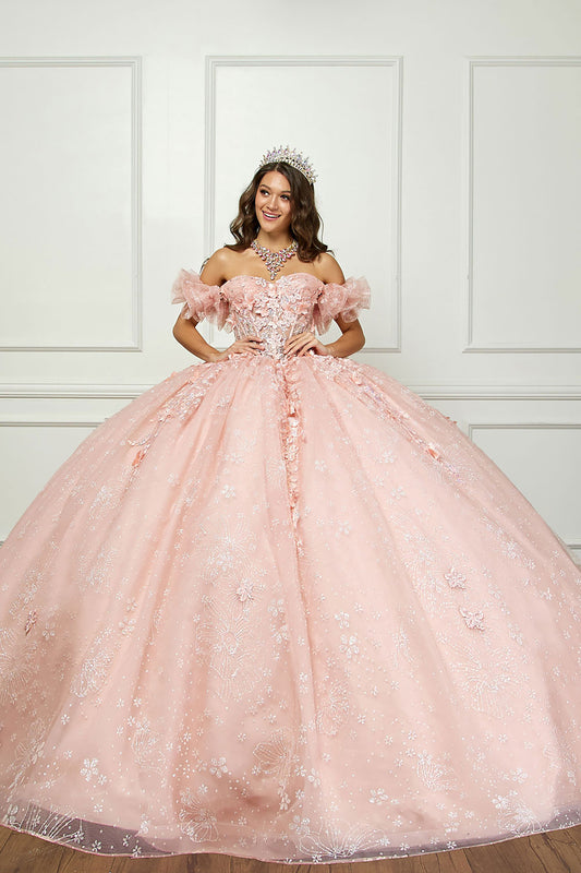 Quinceañera | Long Train, 3D Flowers, Rhinestones w/ Embroidered See-through Bodice Quince dress | Detachable Ruffle Sleeves - front view of woman smiling and wearing crown on head