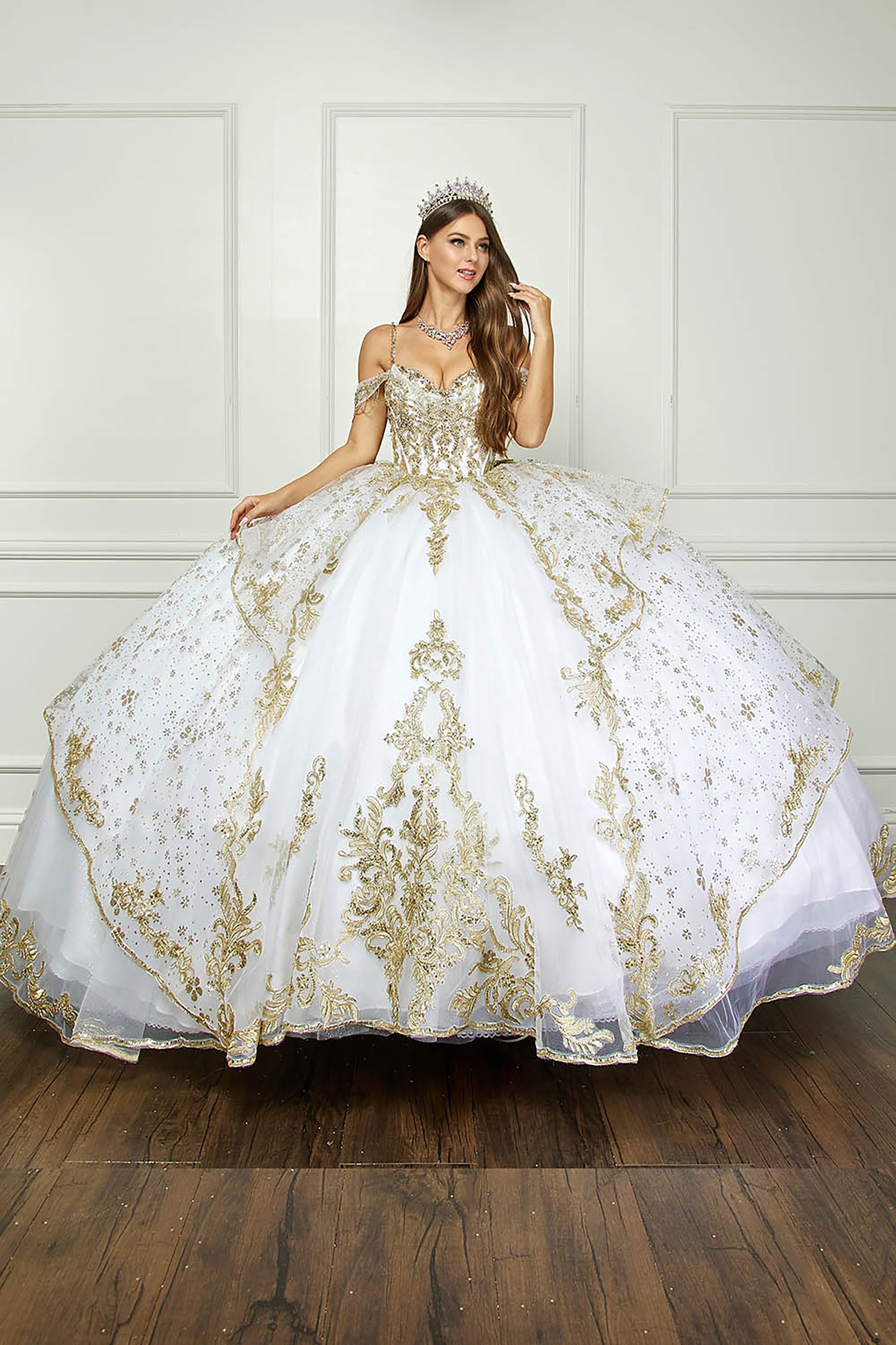 Ivory/Gold Off Shoulder Epaulets Sleeve with Detachable Cathedral Tulle Train Quince Ball Gown - full front view of woman wearing dress with hands touching hair