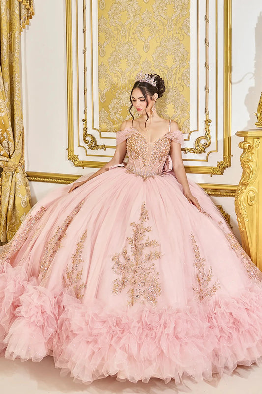 Front view of blush quinceañera ball gown featuring a crystal-embellished sweetheart corset bodice, off-the-shoulder straps, and voluminous ruffled tulle skirt