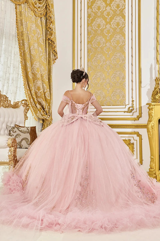 Back view of blush quinceañera ball gown with off-the-shoulder straps, beaded corset back, oversized bow detail, and full glitter tulle skirt with train