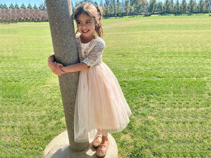 Champagne USA Made | 3/4 sleeve Lattice Flower Embroidered Lace with Satin & Crystal Tulle Flower Girl Dress - girl wearing dress hugging concrete pole