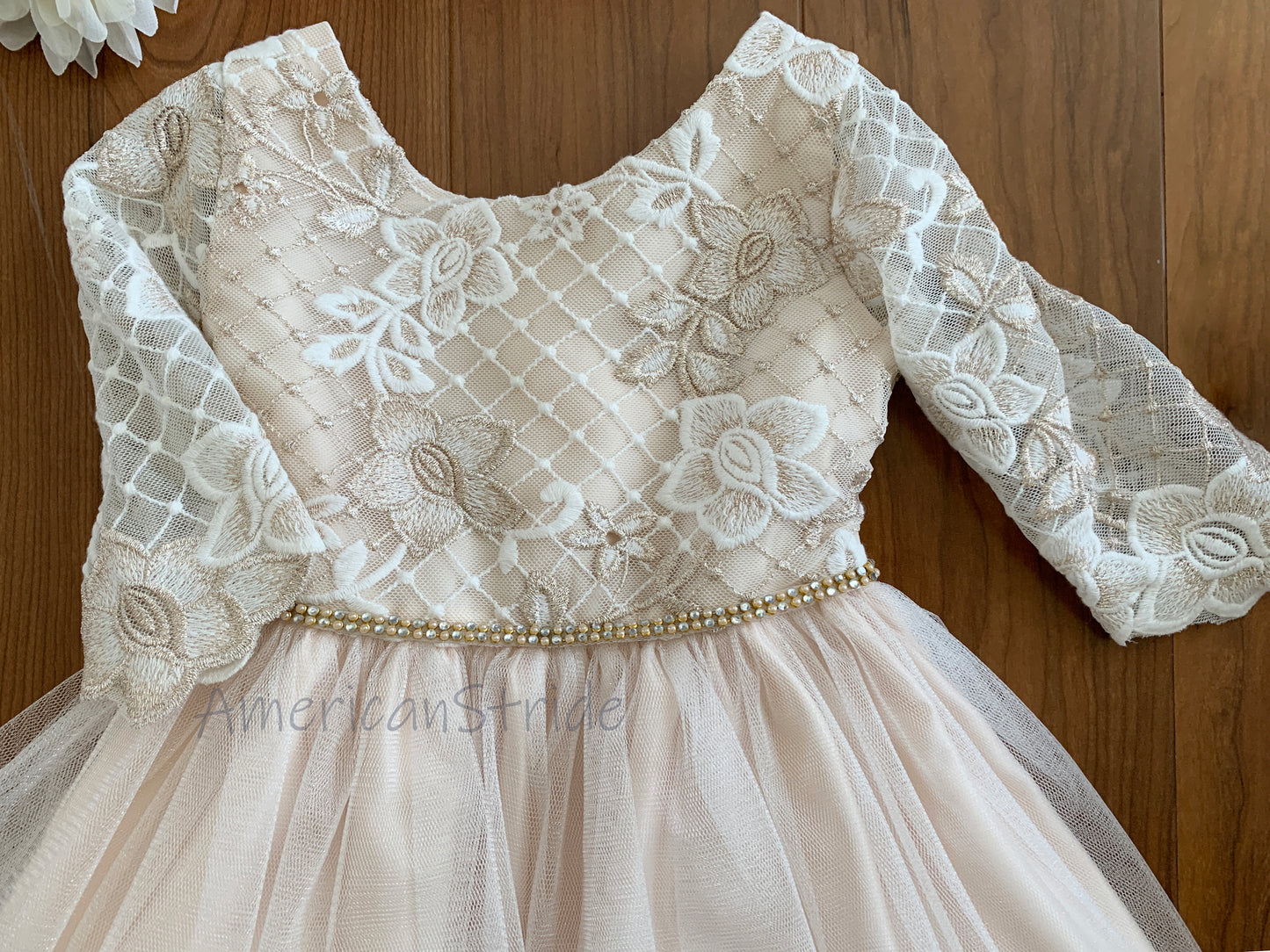 Champagne USA Made | 3/4 sleeve Lattice Flower Embroidered Lace with Satin & Crystal Tulle Flower Girl Dress - zoomed in front view of dress with pearl sash belt