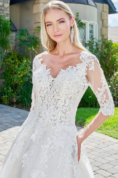 Front close-up upper view highlighting the shimmering gemstone embellishments on the mid-length sleeves and the intricate embroidery across the plunging V-neck bodice.
