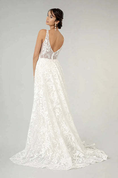 Back full-length view displaying the dramatic flared mermaid skirt and the full sweep of the sparkling bridal train.
