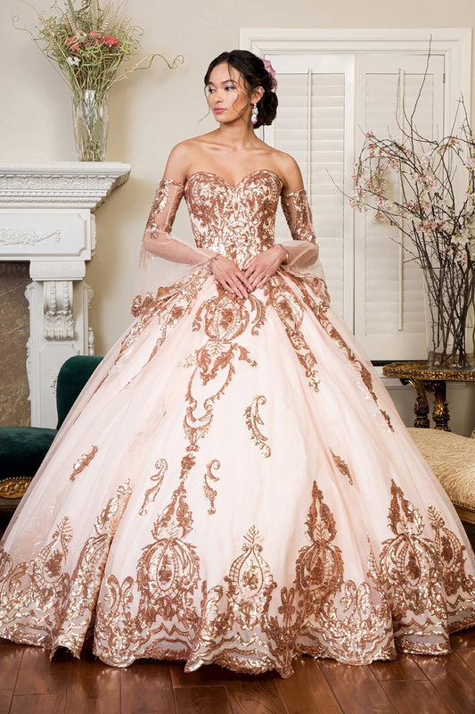 Detailed view highlights a champagne quinceañera dress with sequin embellishments, glitter mesh and detachable sleeves.