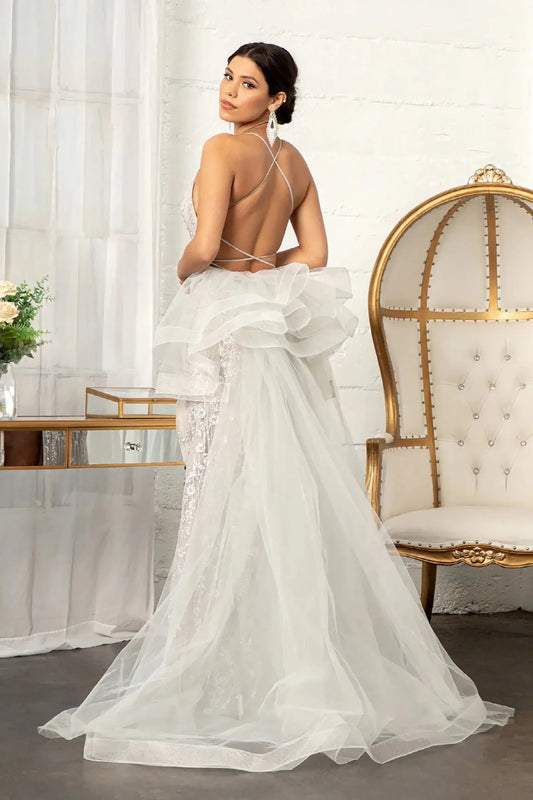 Back full-length view of of a  Silver & Nude jewel-embellished mermaid prom dress with side slit and detachable mesh layer