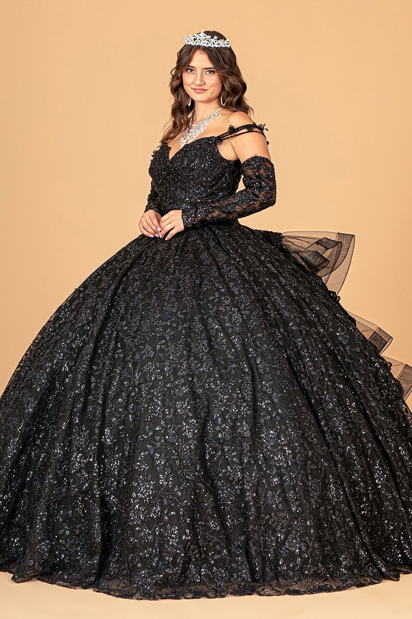 Side Angle of Black Mesh Quince Dress with Removable Long Sleeves and Ribbon/Ruffled Train