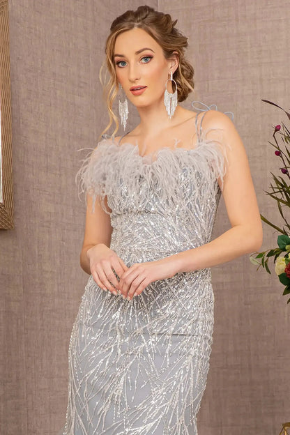 Front close-up upper view of  Silver sequin sweetheart trumpet prom dress with feather embellishments