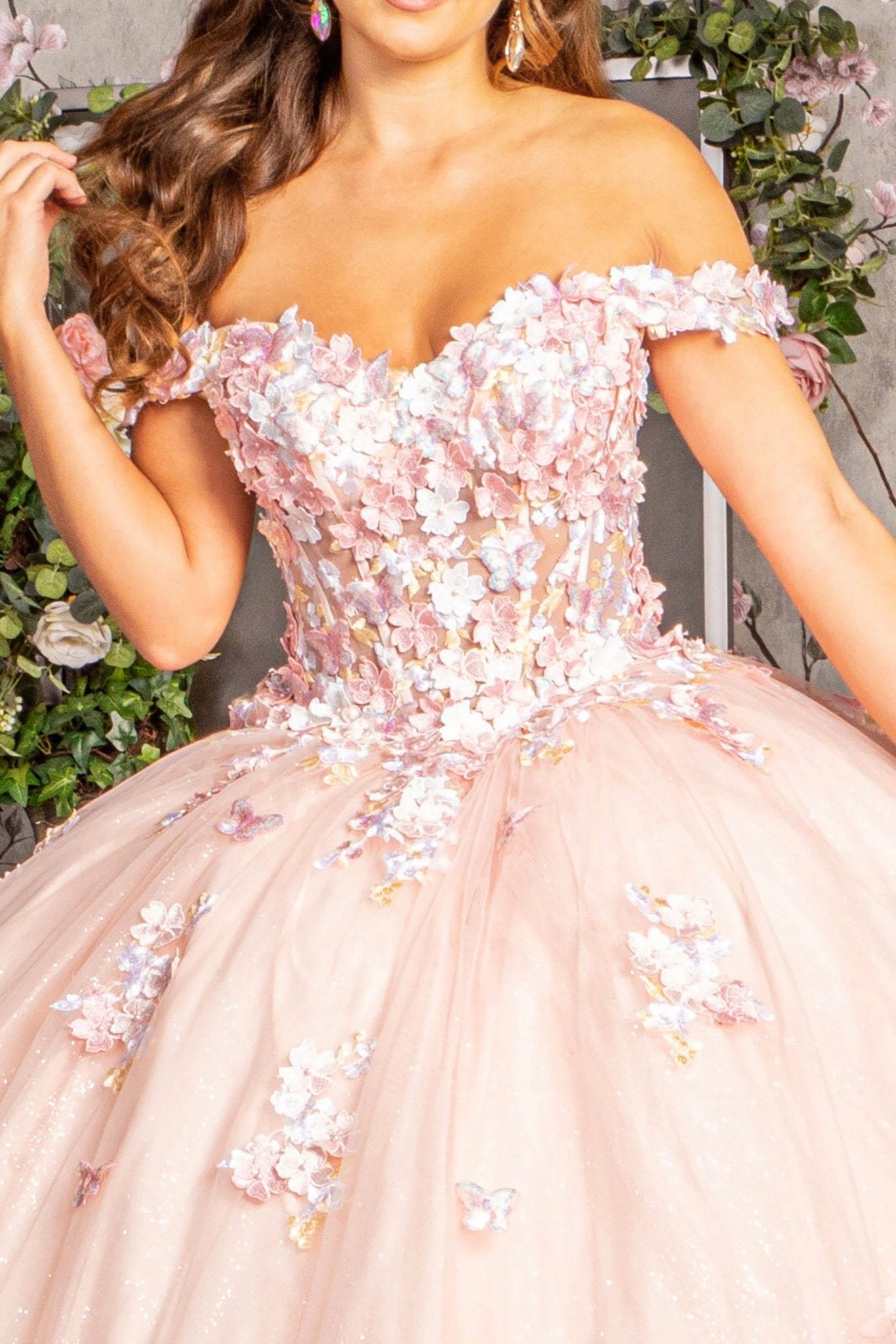 Pink floral off-shoulder dress with a soft focus background