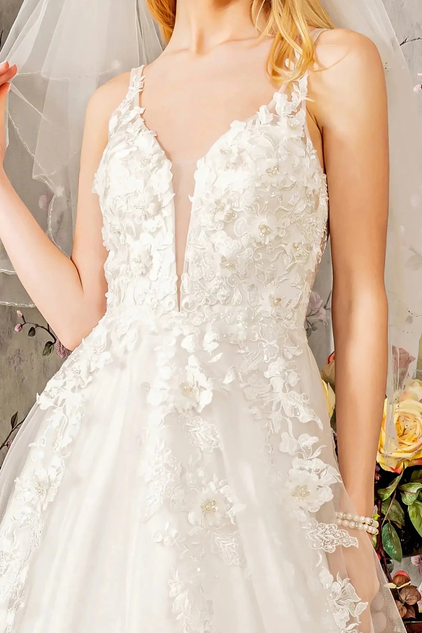 Front close-up upper view highlighting the intricate floral embroidered bodice, detailed with shimmering embellishments that catch the light across the sweetheart curve.