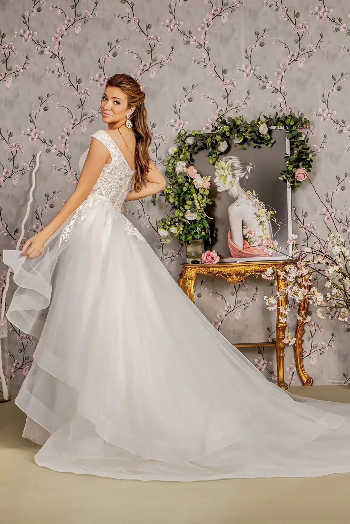 Back full-length view showcasing the fitted mermaid silhouette and the dual-layered look of the narrow embroidered train paired with the wider, flowing detachable waist drape.