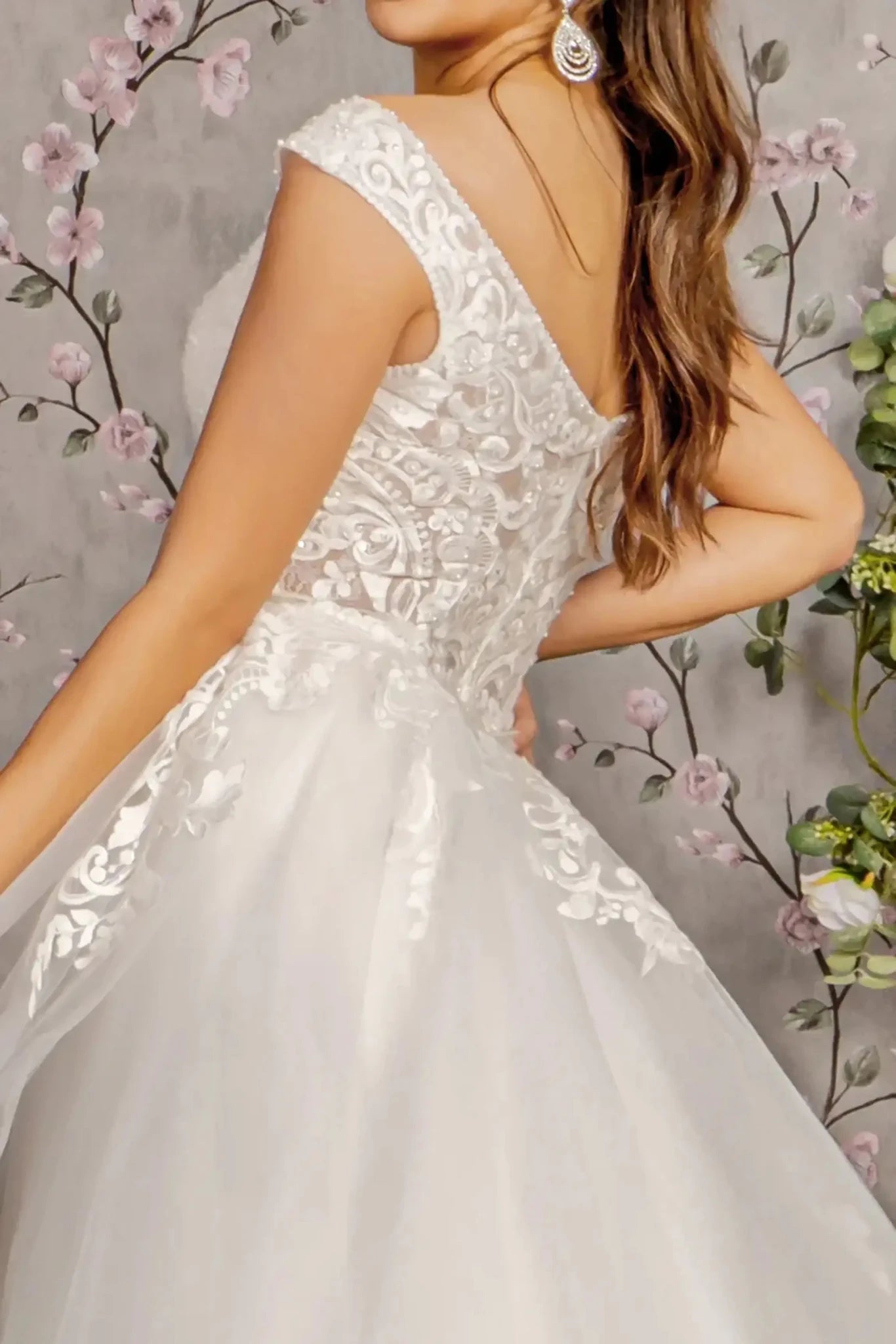 Back close-up upper view focusing on the sheer open back design and the discreet central zipper closure, framed by delicate floral beadwork and lace appliqués.