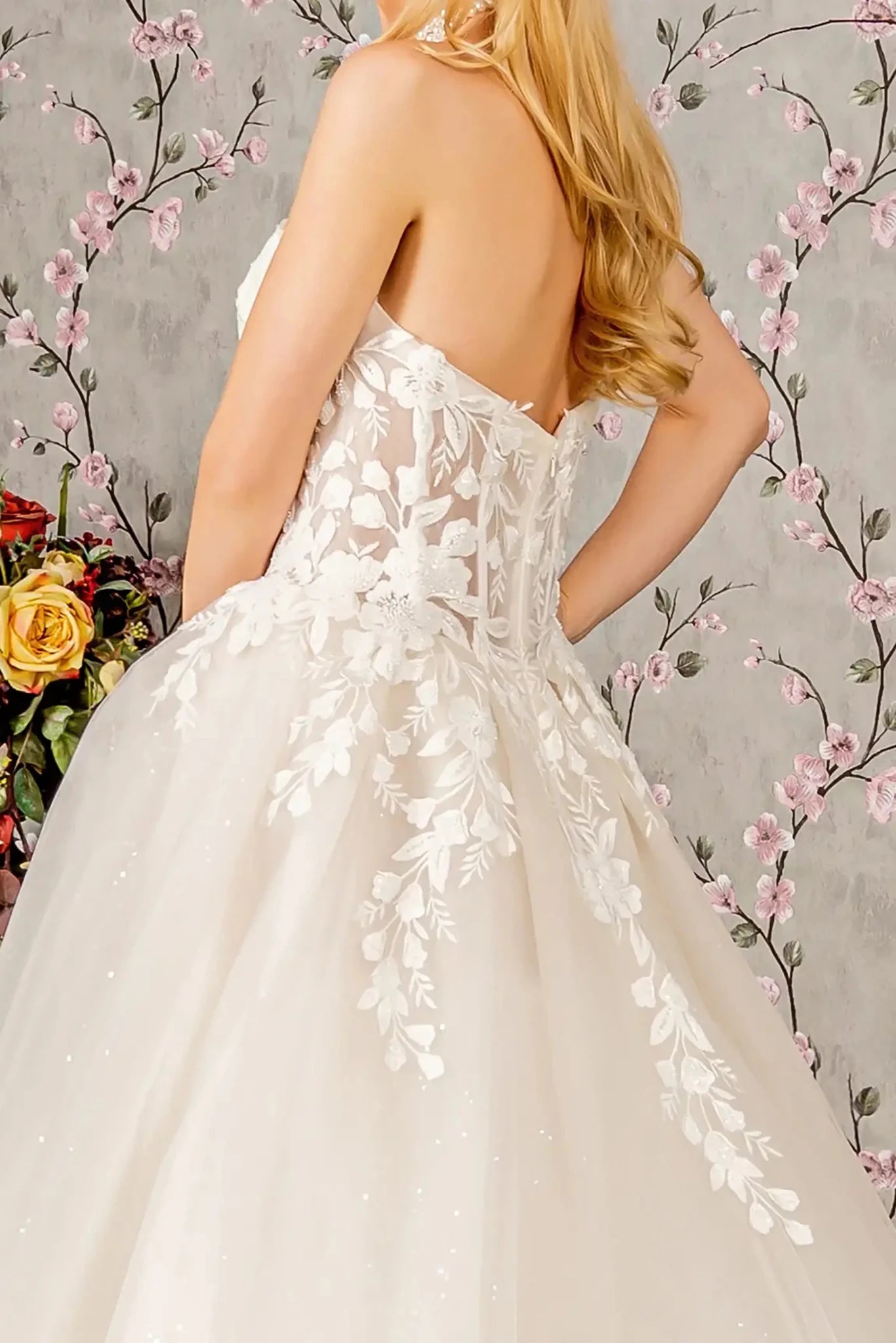 Back close-up upper view focusing on the sheer open back design and the sleek central zipper closure that provides a clean, modern finish to the embellished bodice.