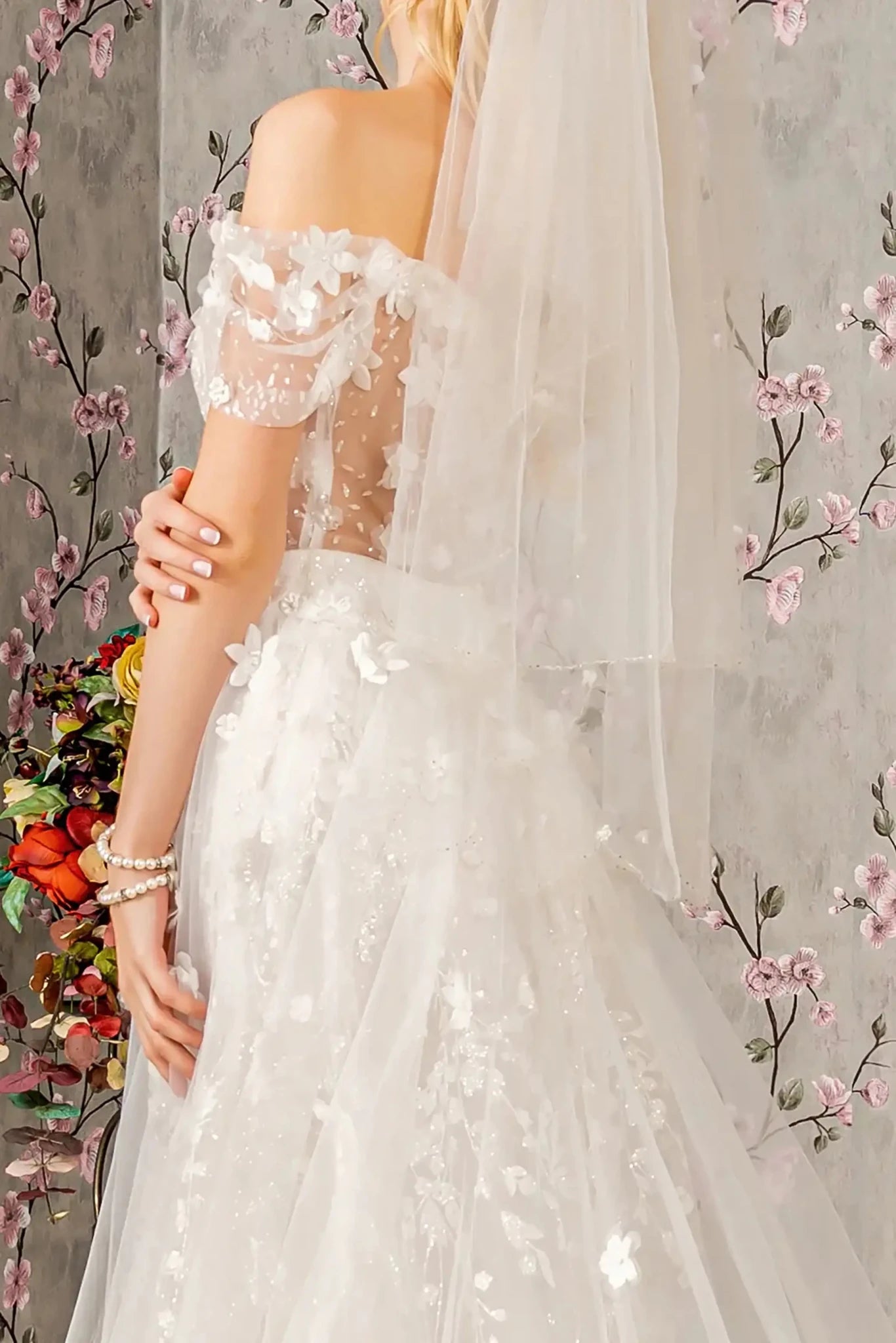 Back close-up upper view focusing on the elegant open back design and the clean, vertical line of the central zipper closure set against the embellished sheer mesh.