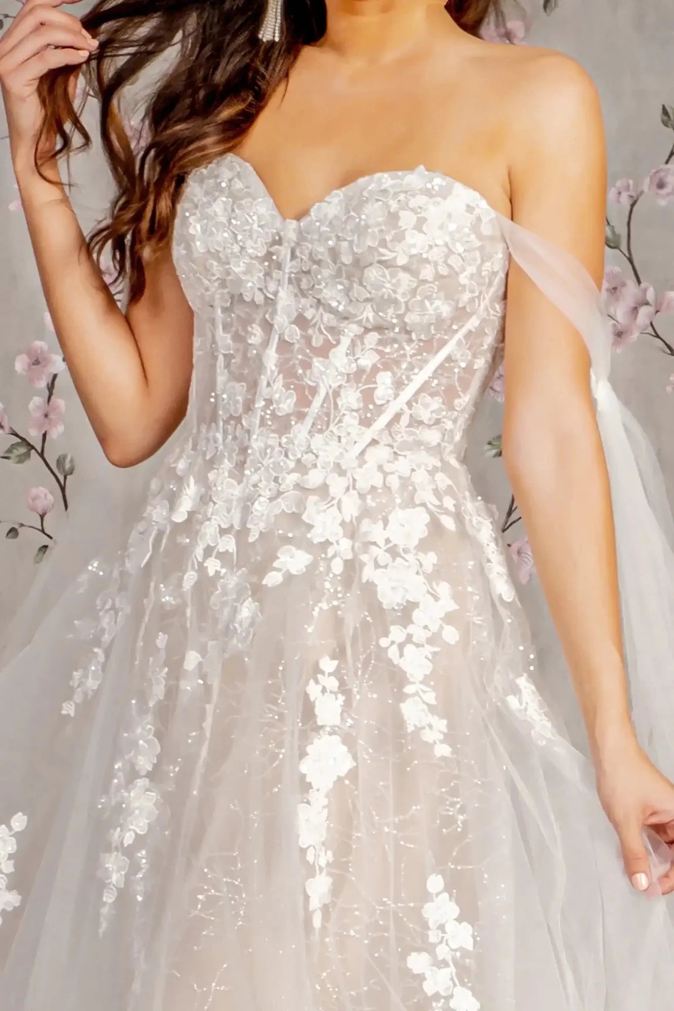 Front close-up upper view highlighting the dense beaded embroidery and shimmering sequins that transition into a sparkling glitter finish across the bodice.