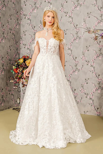 Front full-length view of an ivory ball gown featuring an illusion sweetheart neckline, off-shoulder mesh bodice, and a voluminous skirt adorned with appliqué embroidery, jewels, and sequins.