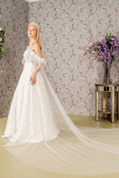 Back full-length view showcasing the regal silhouette of the ball gown and the dramatic sweep of the sheer drape as it blends into the expansive embroidered train.