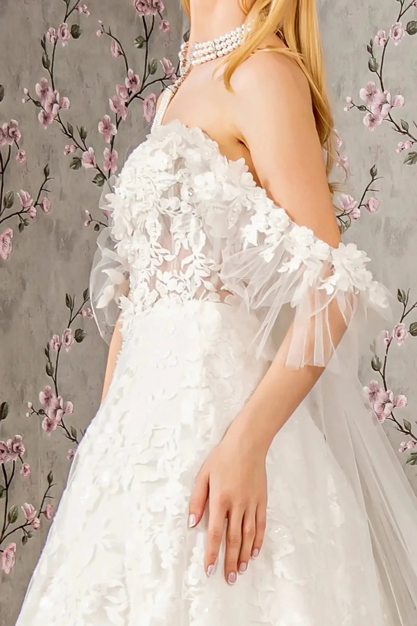 Back close-up upper view focusing on the elegant long sheer back drape and the seamless integration of the central zipper closure beneath the translucent fabric.