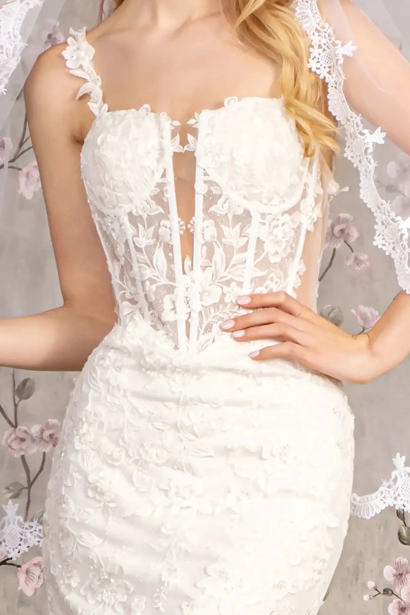 Front close-up upper view highlighting the intricate combination of floral embroidery, shimmering sequins, and fine glitter accents across the translucent mesh bodice.