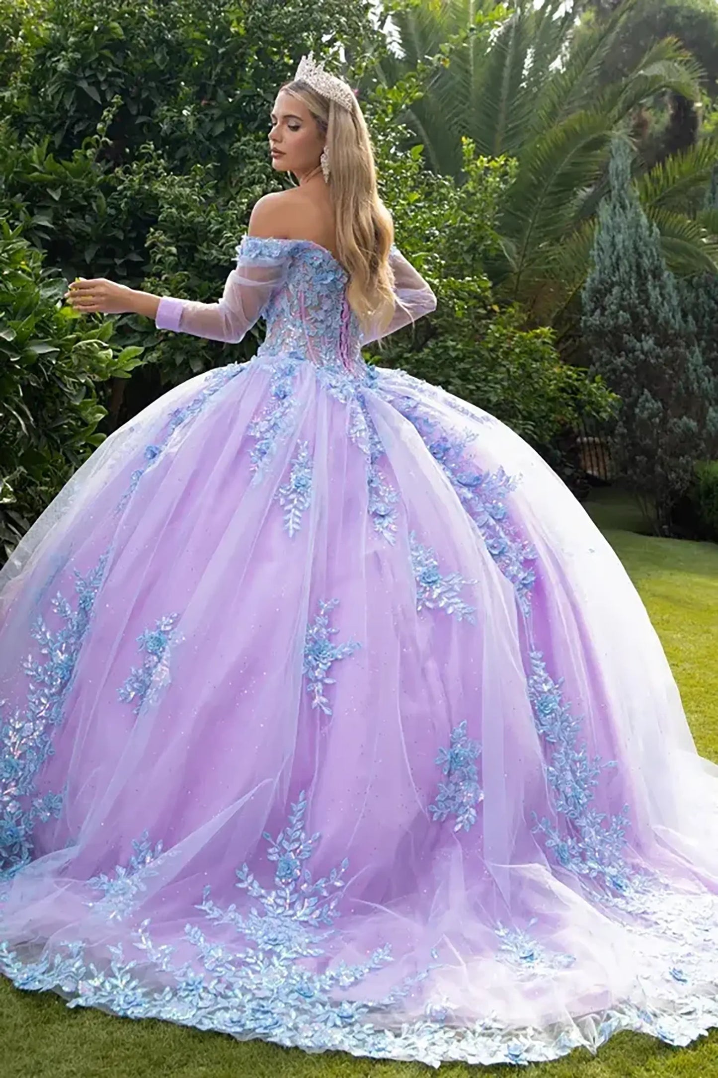 Woman in a lilac quinceanera dress  with blue embroidery and long train