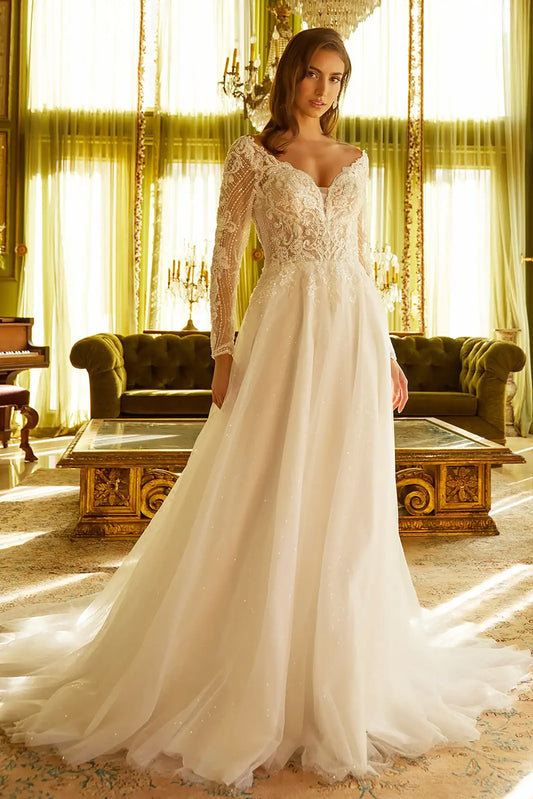 Front full-length view of an off-white A-line wedding dress featuring a wide front V-neckline, long embellished sleeves, and a hidden sequined mesh skirt underlay.