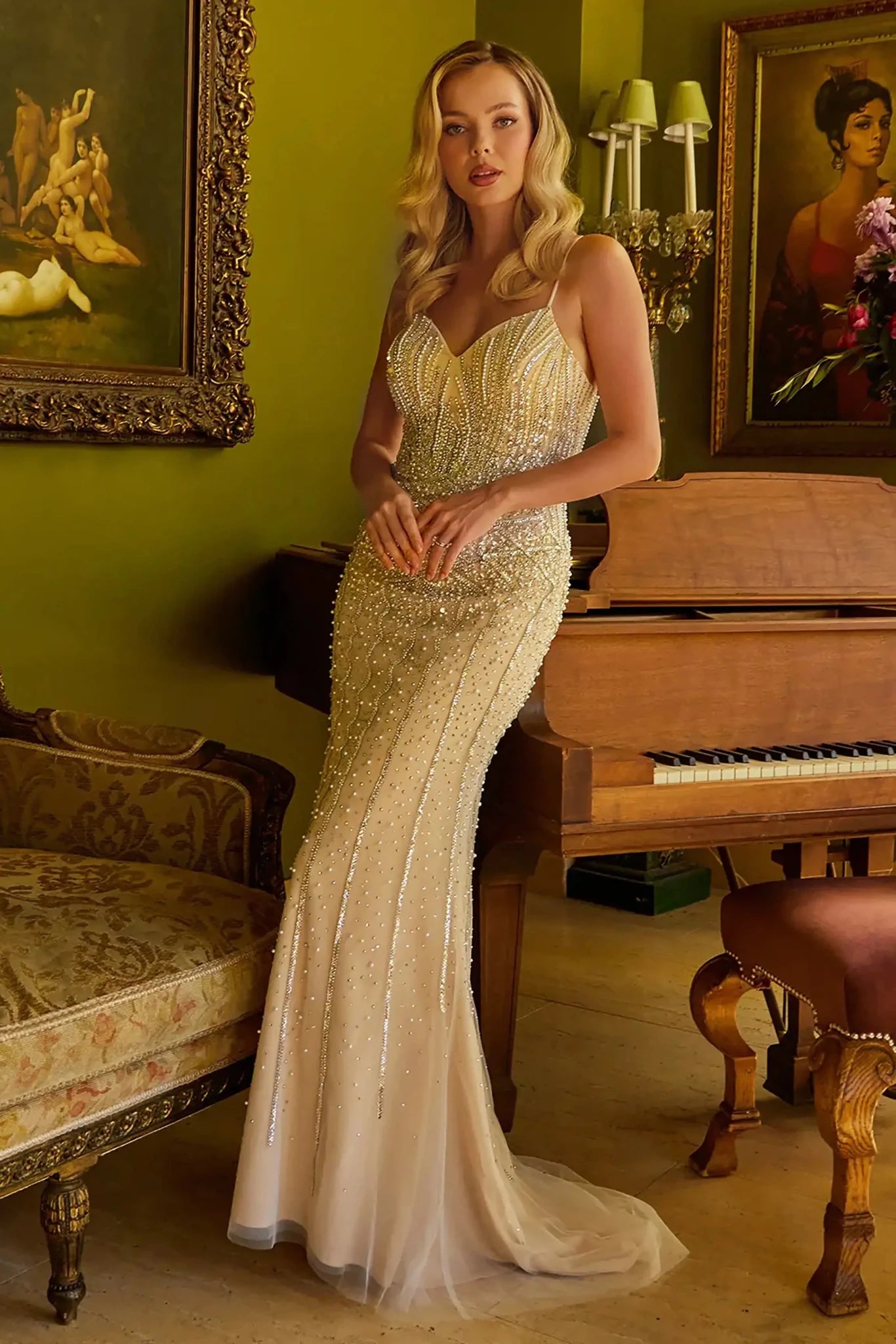 Front full-length view of a  Champagne & Nude beaded fitted prom dress with v-neck corset and patterned skirt