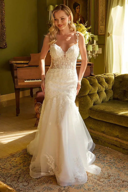 Front full-length view of an off-white mermaid wedding dress featuring a V-neckline corset bodice, beaded floral embroidery, and a distinct structured-hem skirt.