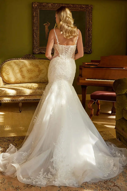 Back full-length view showcasing the dramatic flared mermaid silhouette and the crisp, architectural lines of the structured hem as it transitions into the train.