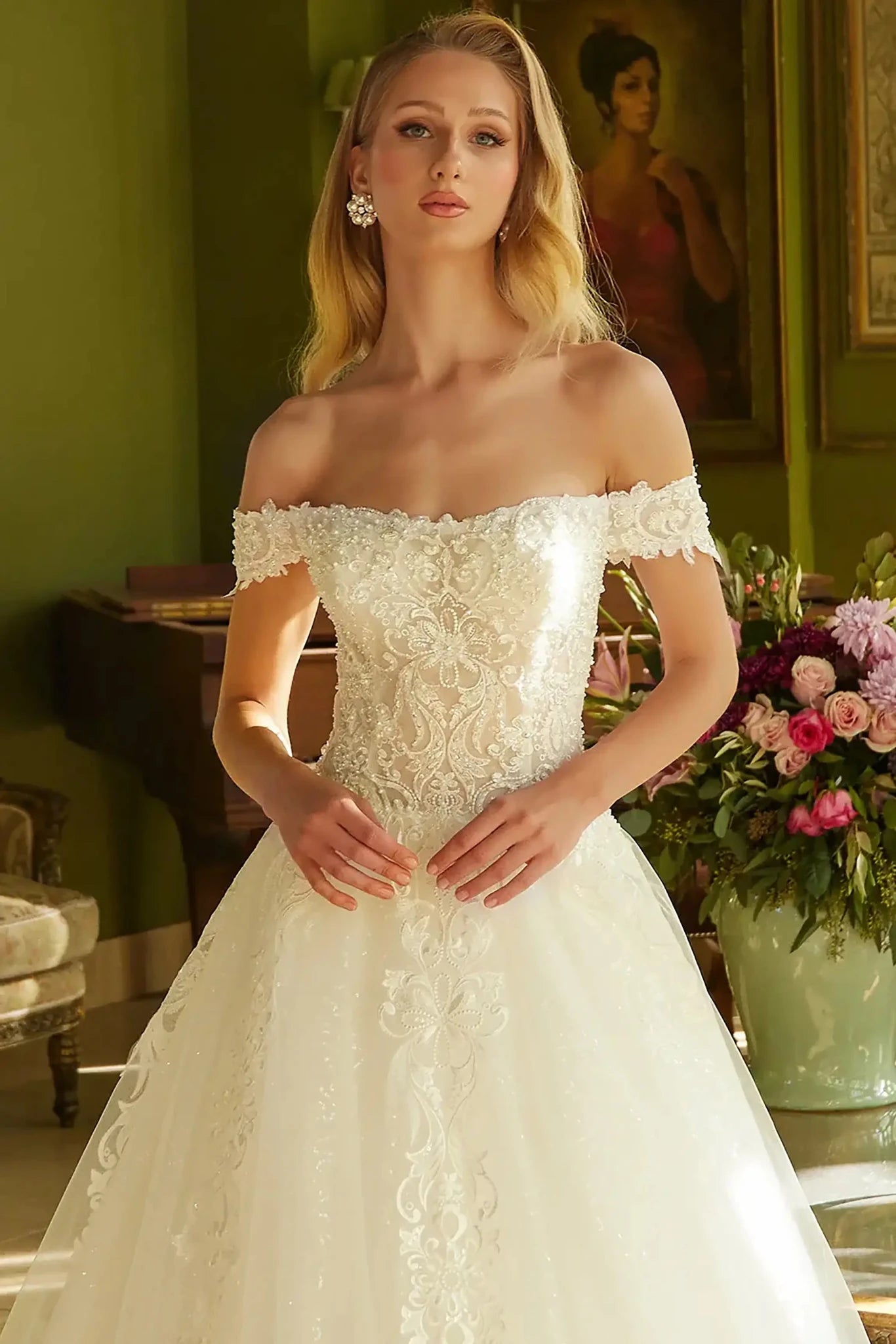 Front close-up upper view highlighting the intricate beadwork across the sweetheart bodice and the delicate texture of the off-shoulder sleeves.