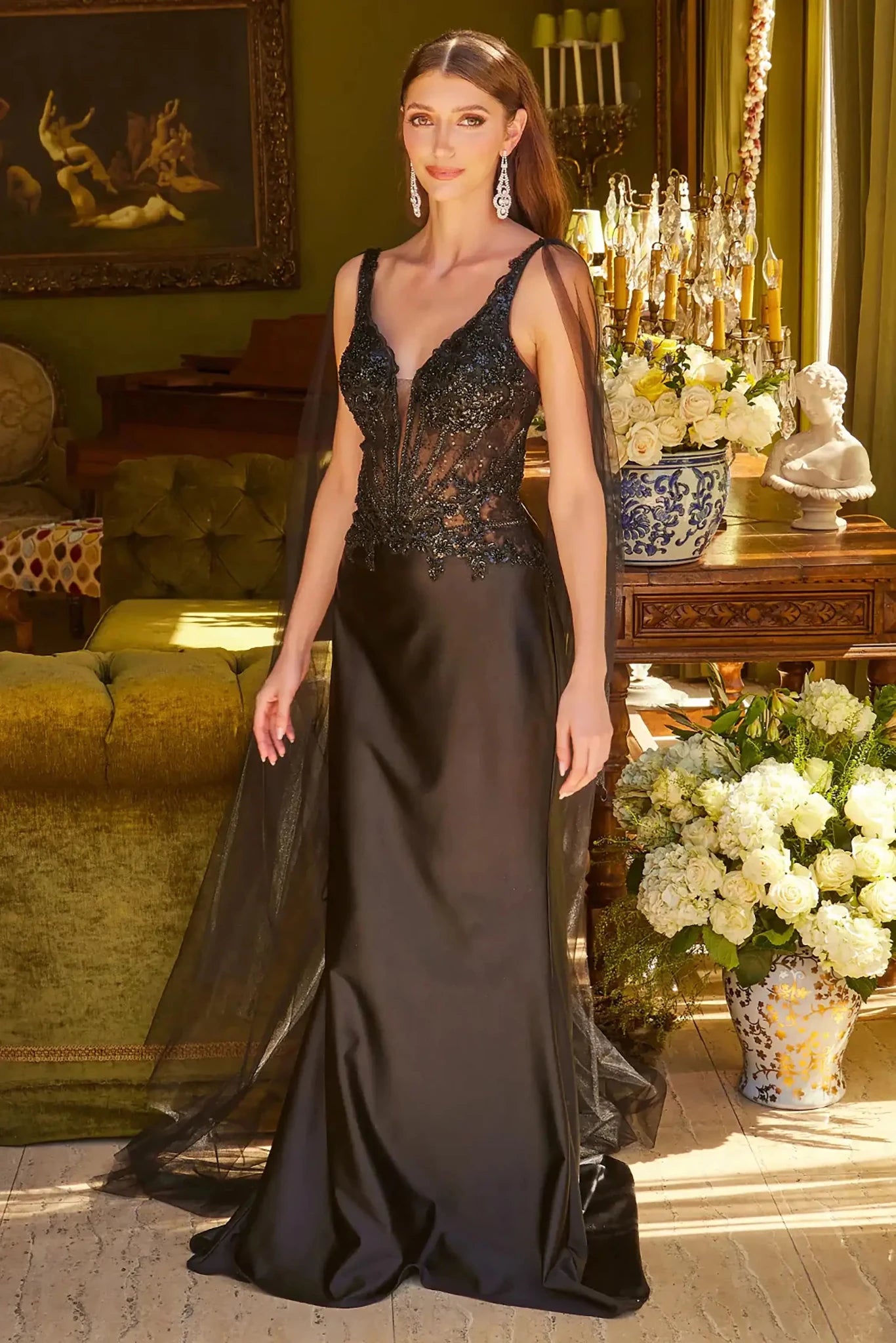 Front full-length view of a  Black beaded satin prom dress with v-neck corset and Watteau train