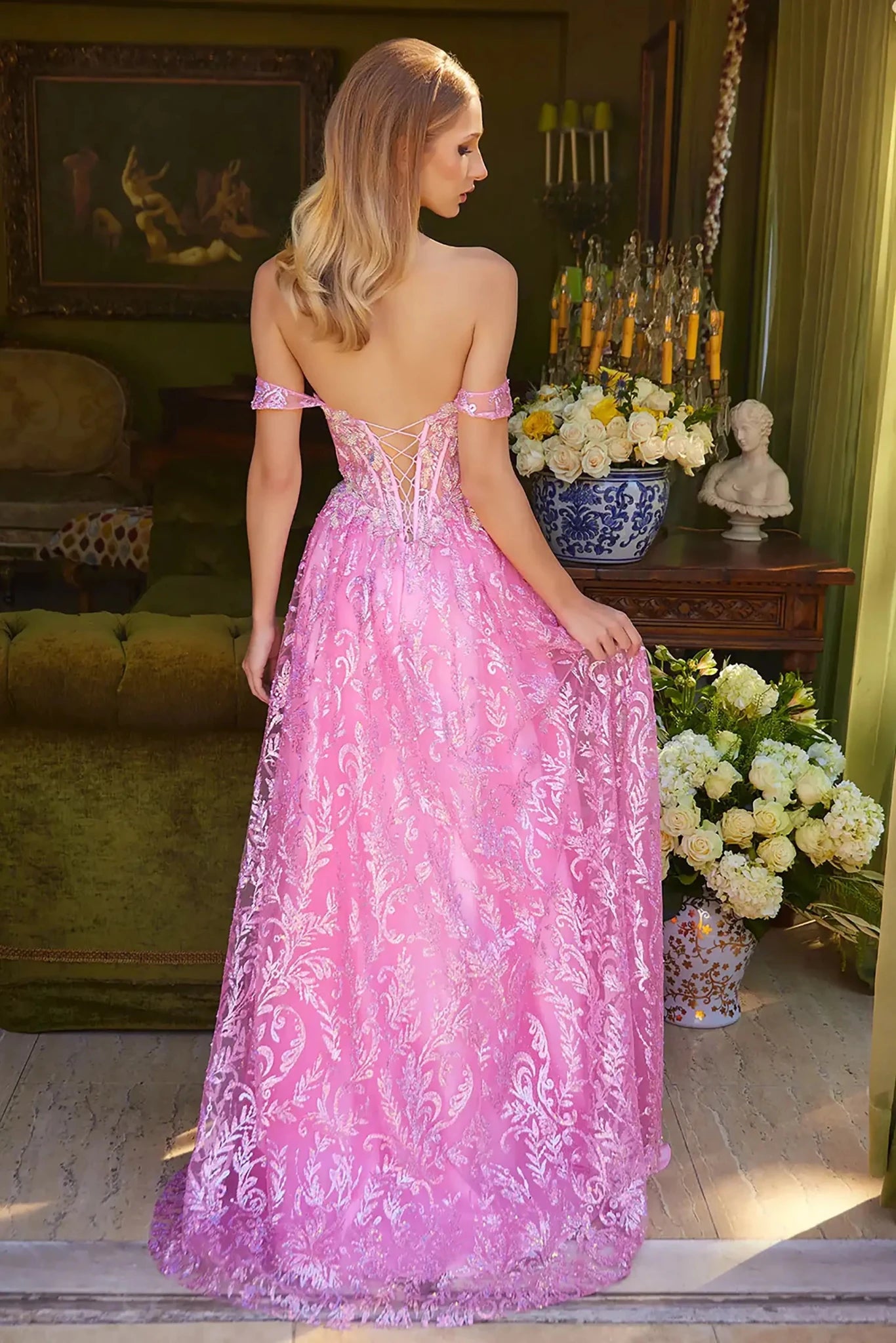 Back full-length view of of a  Pink off-shoulder beaded sequin prom dress with sweetheart neckline and slit