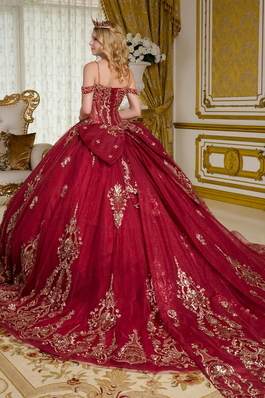 Back view of burgundy quinceañera ball gown featuring lace-up corset back, off-the-shoulder straps, oversized detachable bow, gold embroidery, and voluminous glitter tulle skirt