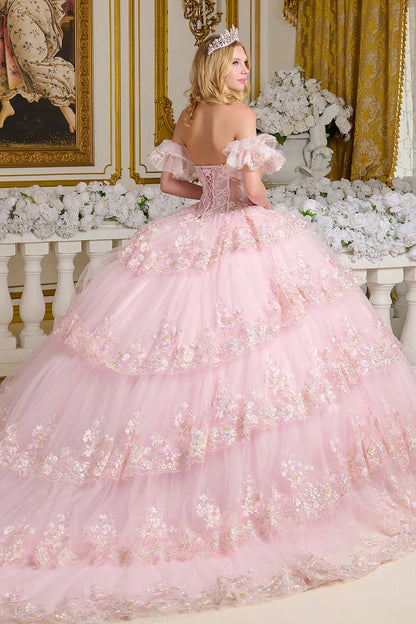 Pink quince ball gown with floral details in a decorated room