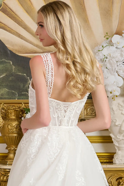 Woman in a white lace wedding dress with a gold decorative background