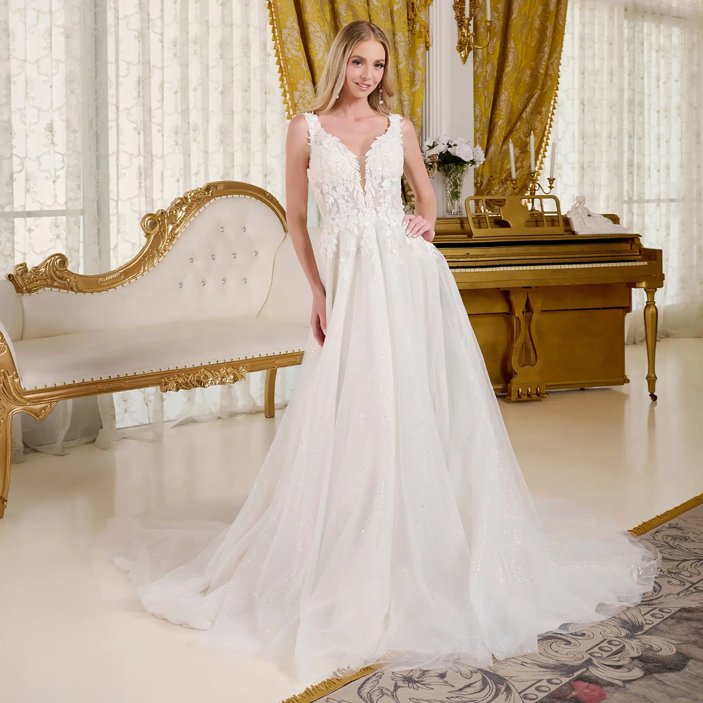 Woman in a wedding dress with a fitted V-neck bodice and beaded straps in a elegant room