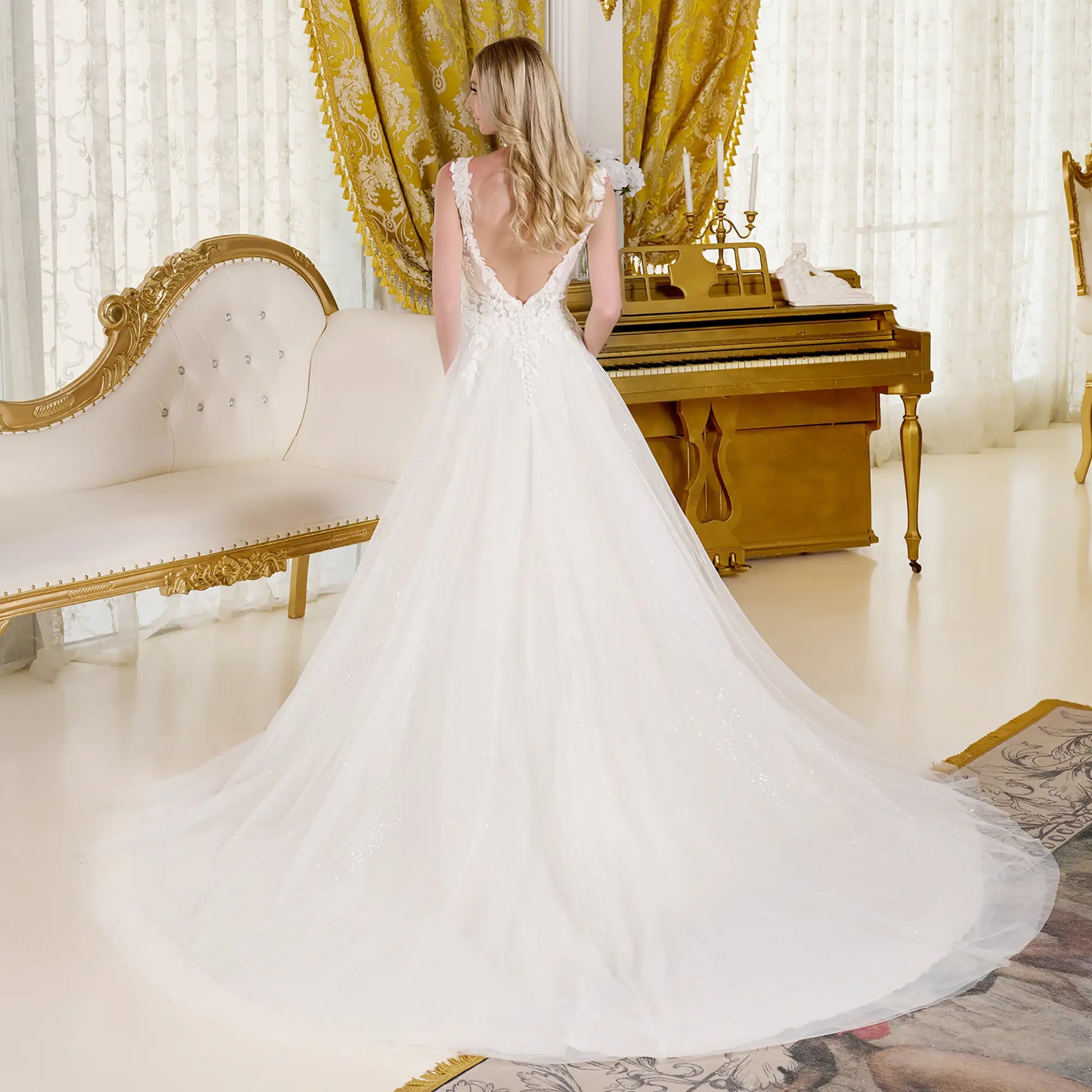 Beautiful back view of a woman wearing a wedding dress in a full terrain dress