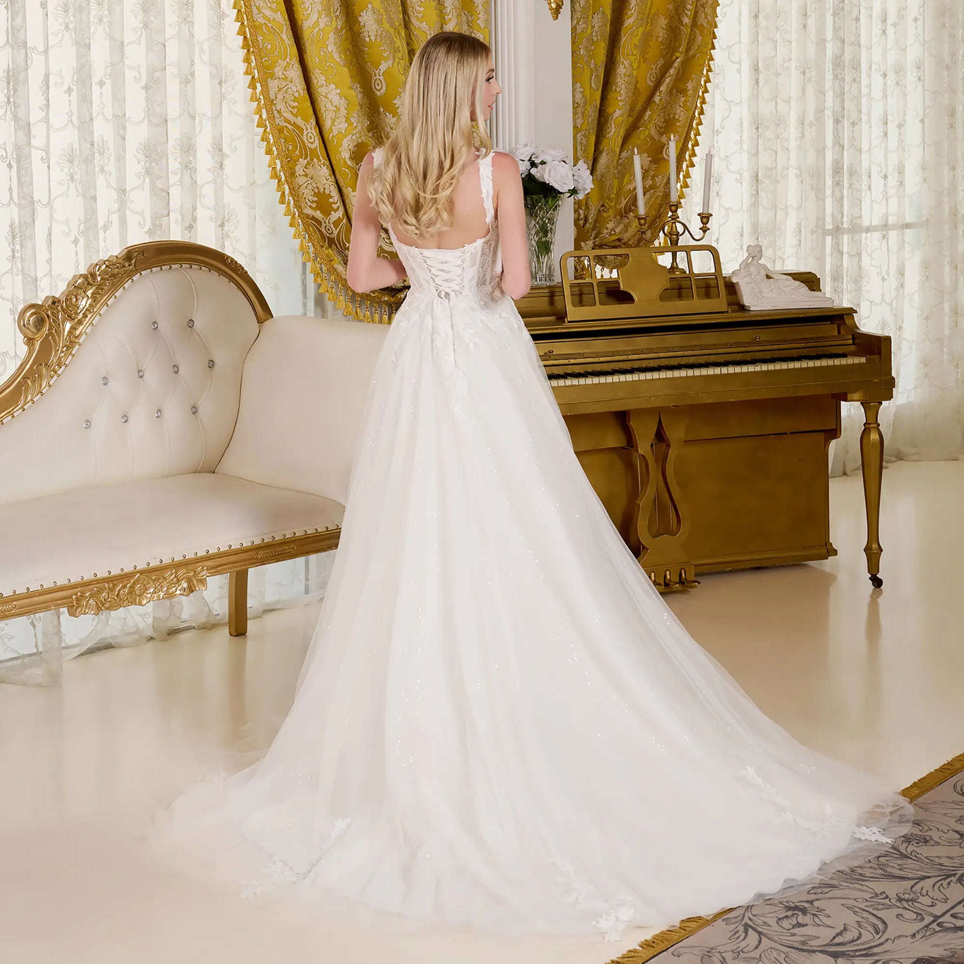 Woman wearing a wedding dress in an opulent room