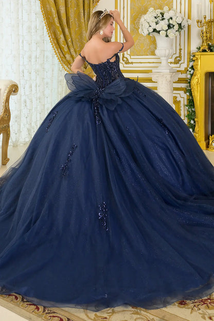 Girl in a quinceañera dress with satin-decorated bodice with a tiara in an elegant interior setting.