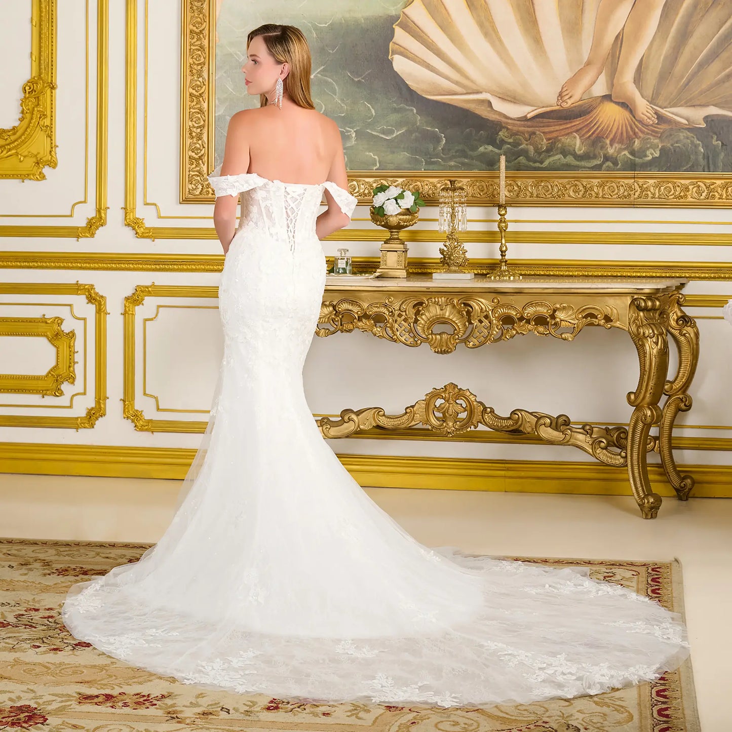 Woman wearing a elegant wedding gown in an opulent room