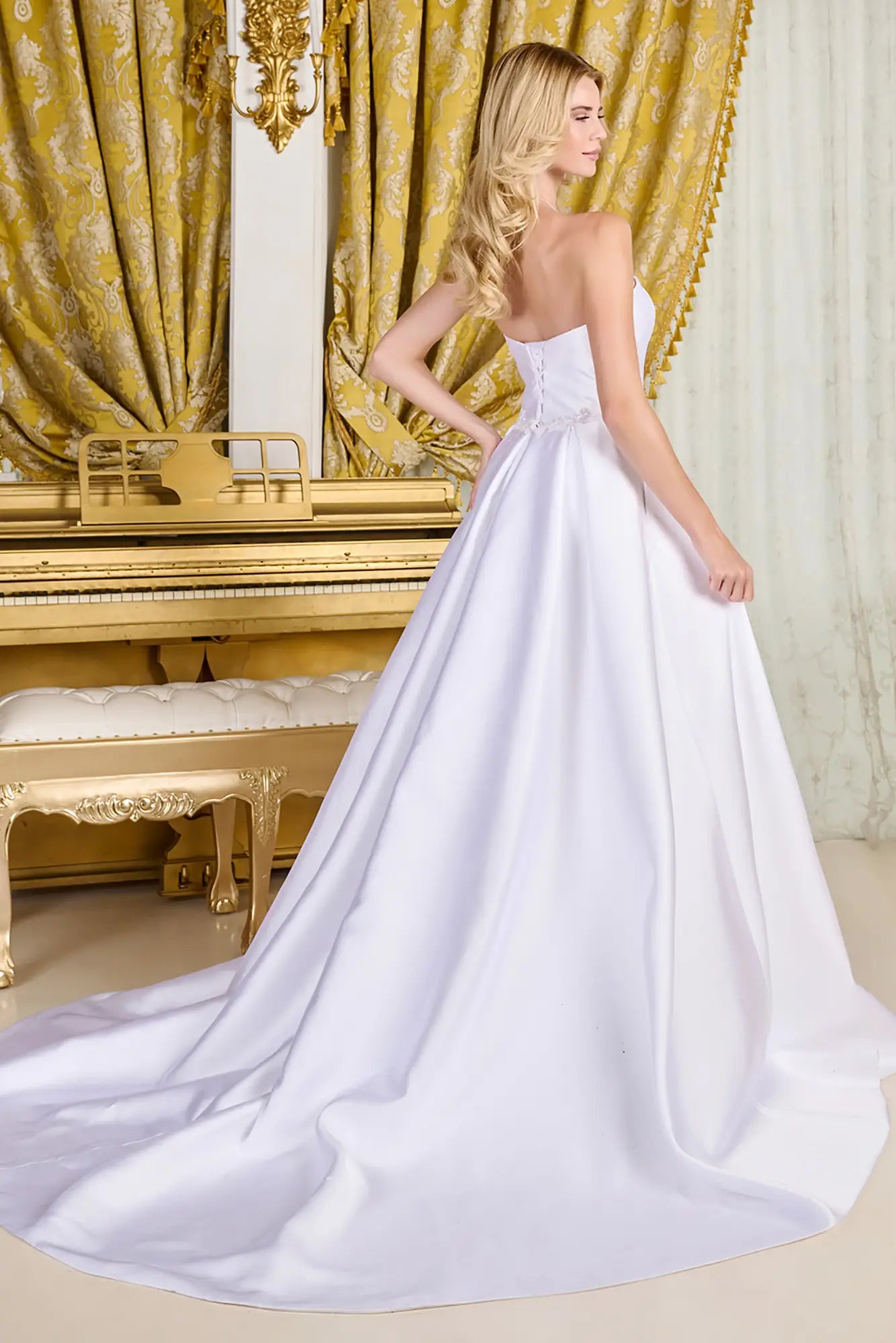 Woman wearing an elegant dress in an opulent room