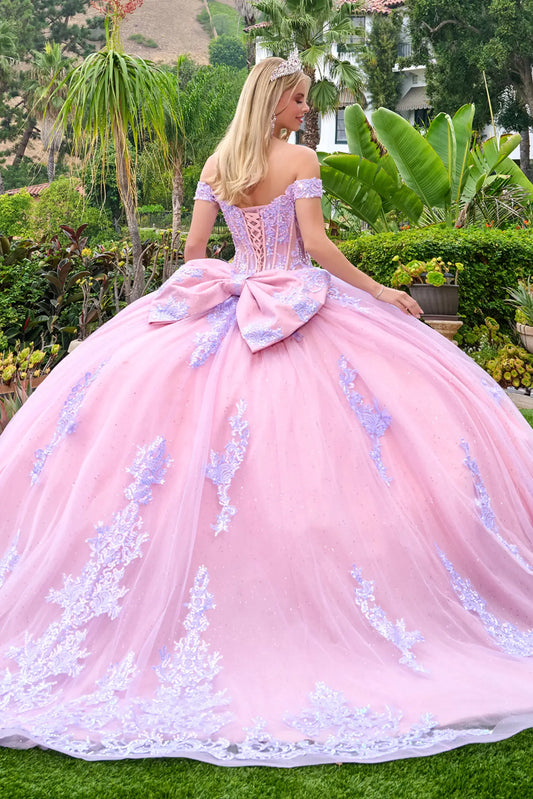 Back view of lilac quinceañera ball gown featuring lace-up corset back, oversized bow detail, and full embroidered tulle skirt.