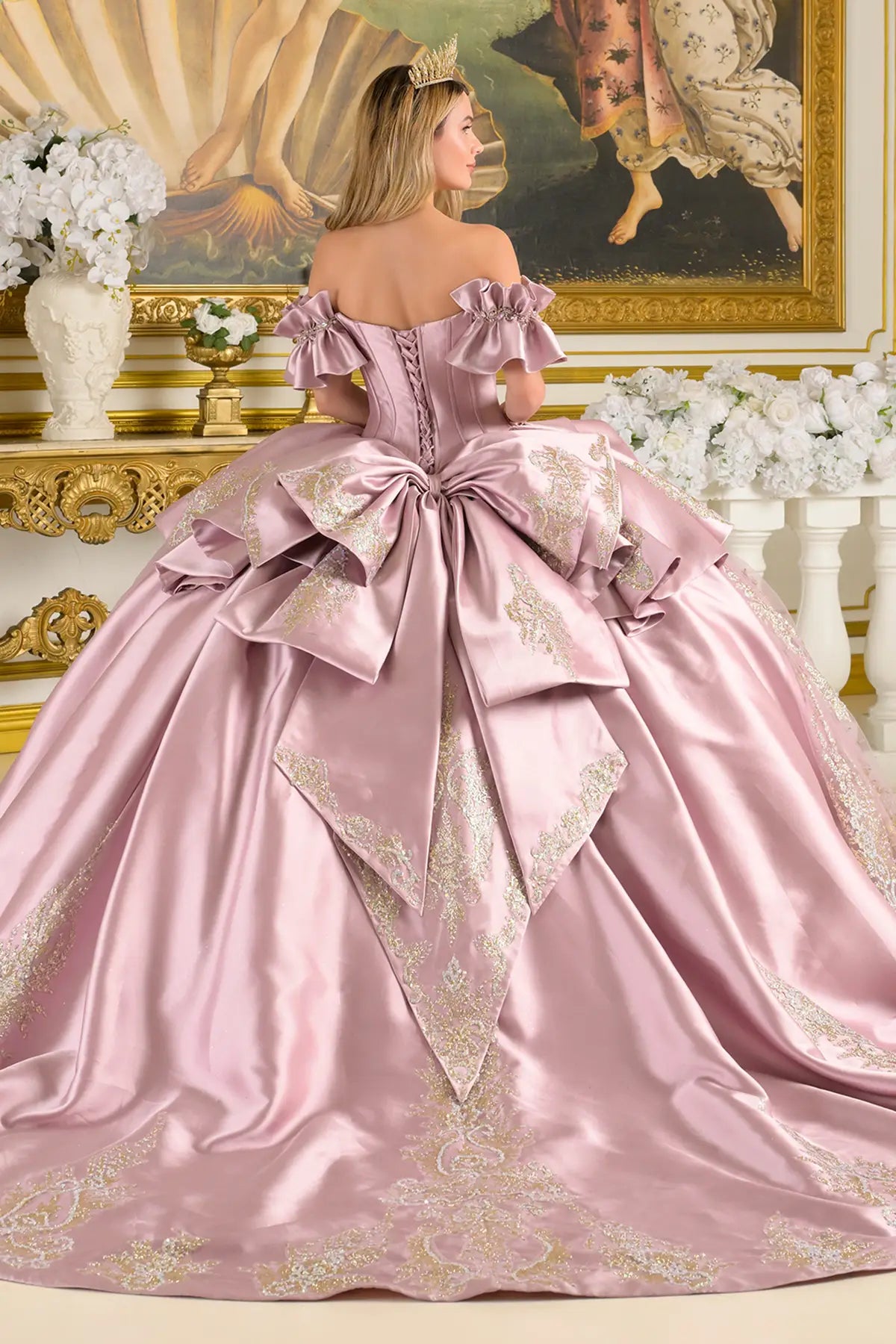 mauve ball gown with intricate details in a decorated room