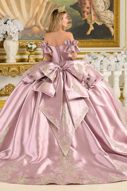mauve ball gown with intricate details in a decorated room