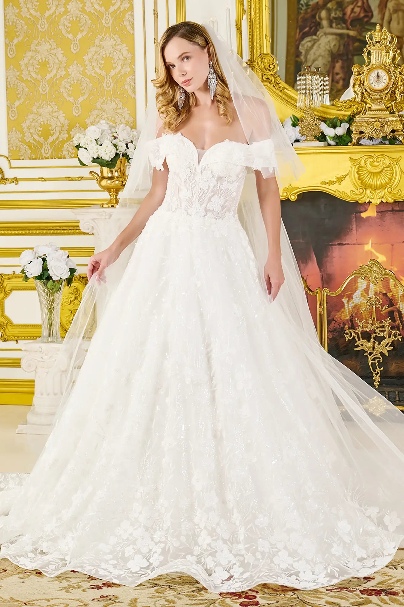 Woman in a white wedding dress standing in an ornate room with gold decor.