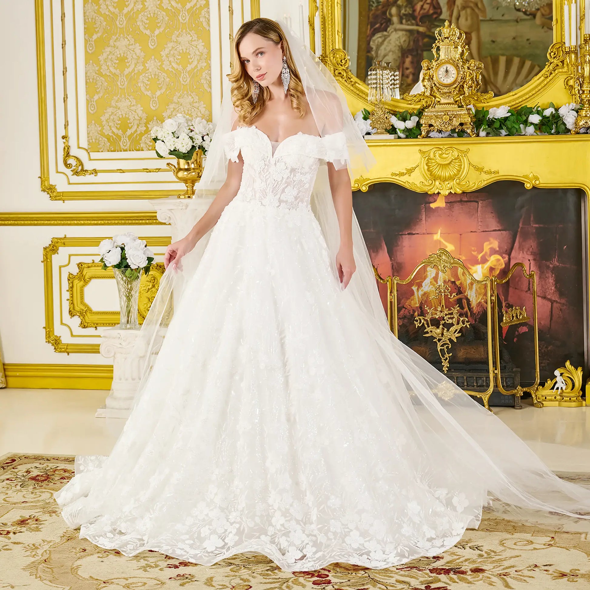 Woman in a white wedding dress standing in an ornate room with gold accents.